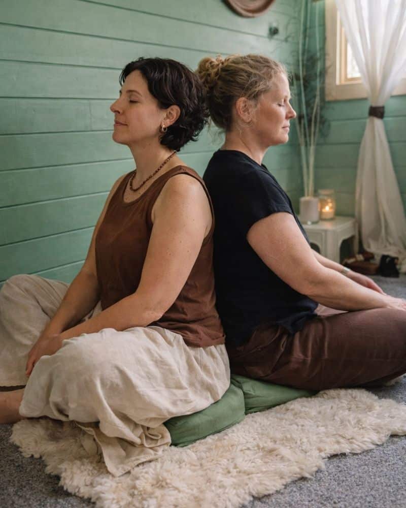 The Belonging - a 2-day self-love retreat in Hampshire. Image shows two of the women who attended practicing connection